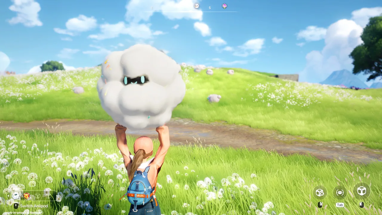 Eine Spielfigur hebt auf einer Blumenwiese ein weißes, wolkenartiges Wesen über den Kopf.